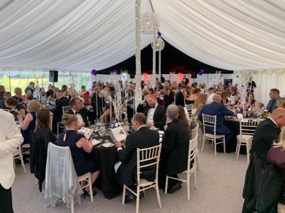 Magic OZ performing around tables at a Weybridge Magician private party